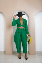 Anulika Aso Oke Set in green with cropped jacket, shawl collar, and high-waisted barrel pants featuring cargo pockets and belt loops.