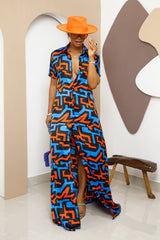 Sophisticated unlined kaftan dress made from traditional silk African Ankara fabric in vibrant multi-color patterns. Perfect for weddings, dinner parties, and formal events. Model height: 5'9".