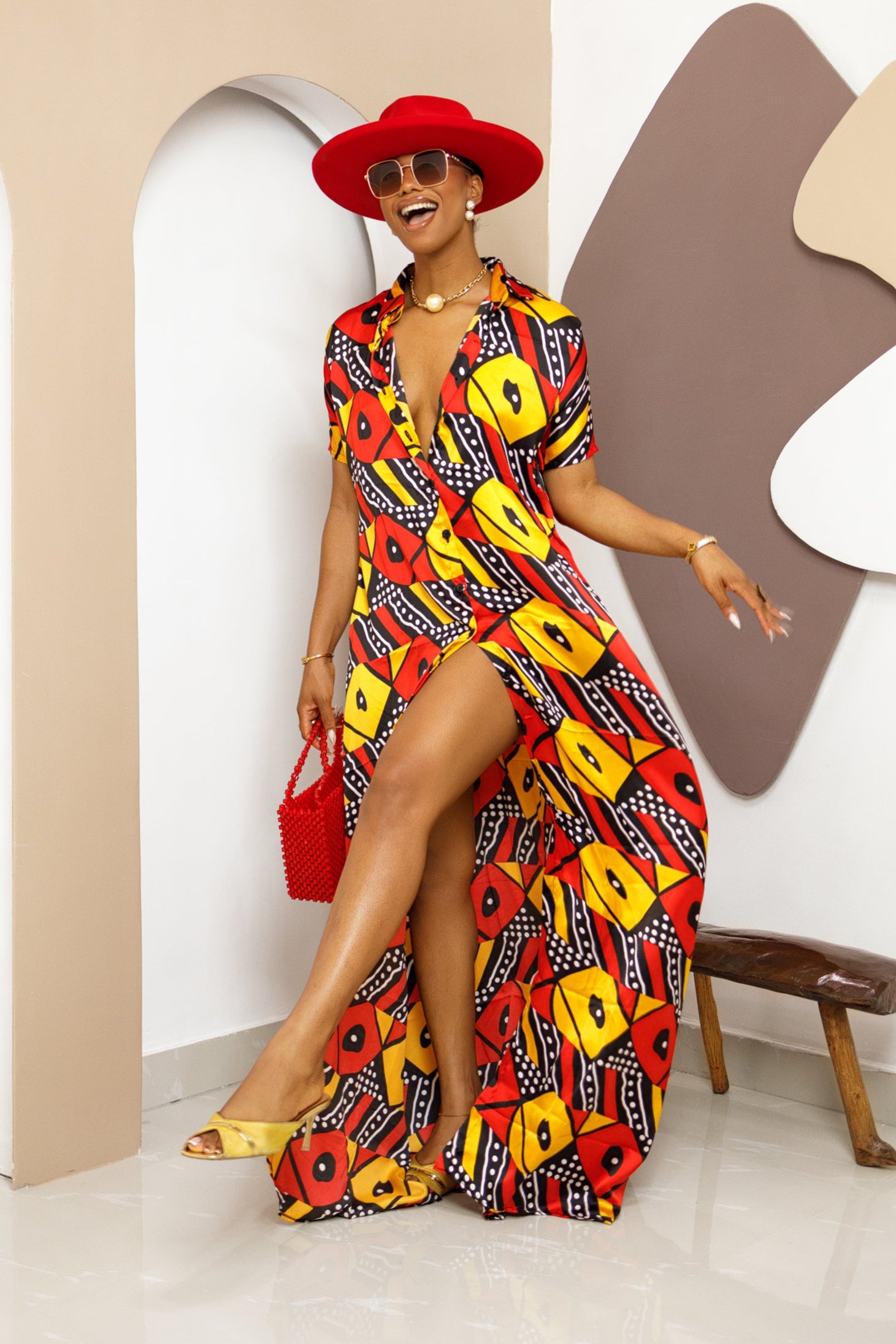 Sophisticated unlined kaftan dress made from traditional silk African Ankara fabric in vibrant multi-color patterns. Perfect for weddings, dinner parties, and formal events. Model height: 5'9".