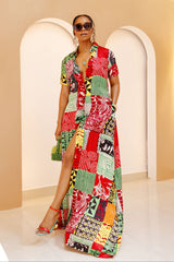 Model wearing Umuada Silk Ankara Kaftan – red, green, and yellow patchwork print maxi shirt dress with front slit.