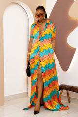 Sophisticated unlined kaftan dress made from traditional silk African Ankara fabric in vibrant multi-color patterns. Perfect for weddings, dinner parties, and formal events. Model height: 5'9".