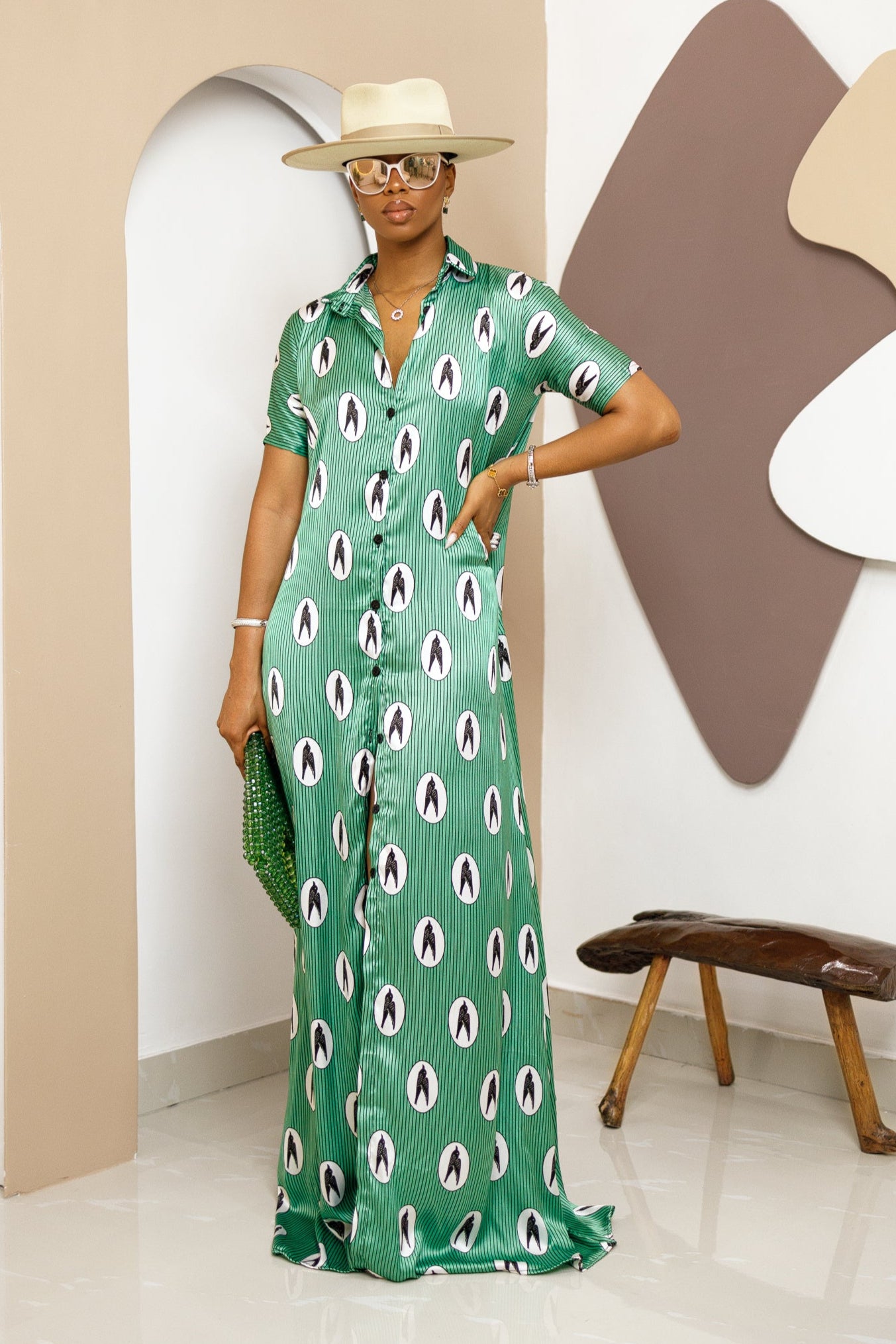 Sophisticated unlined kaftan dress made from traditional silk African Ankara fabric in vibrant multi-color patterns. Perfect for weddings, dinner parties, and formal events. Model height: 5'9".