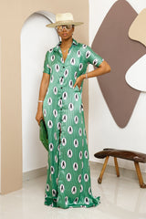 Sophisticated unlined kaftan dress made from traditional silk African Ankara fabric in vibrant multi-color patterns. Perfect for weddings, dinner parties, and formal events. Model height: 5'9".
