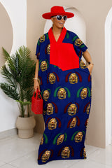 Woman in a blue Isi Agu cotton Ankara kaftan with red Aso Oke embellishment, exuding elegance.