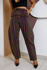 Model wearing Akpu Barrel Pant – striped Aso Oke trousers with high waist and barrel-leg silhouette.