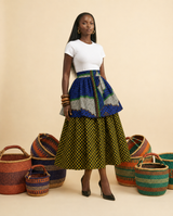 Mmimi Ankara Twi Tier Midi Skirt, a high-waisted tiered tea-length midi skirt with a contrasting flared overskirt.