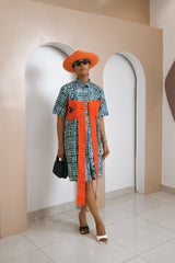 Njideka Adire Dress in green and white cotton with orange Aso Oke bow sleeves, classic collar, and button-down front. Handcrafted in Africa.