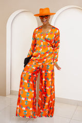 Conjunto de top cruzado y pantalón palazzo de seda Ankara en color naranja vibrante de Omugwo