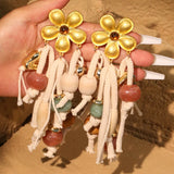 Los pendientes Bloom &amp; Root