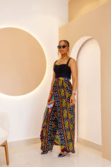 Unisex African Ankara patchwork pants and skirt set in vibrant cotton prints, handcrafted in Africa, featuring elastic waistband and zipper closure.