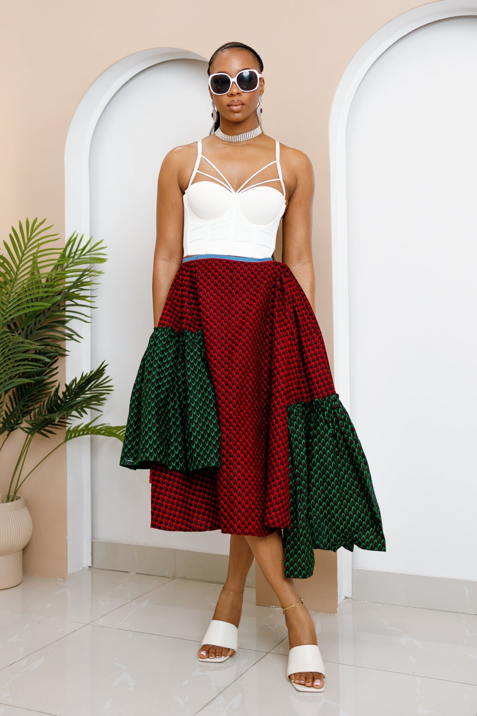 Model wearing Ankara Skirt made from red and green Ankara fabrics