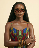 'Candy Aura' Women's Oval Sunglasses - Trendy Korean Style Shades - chest-up portrait crop from mid-chest to just above the head, model facing camera, sunglasses are the PRIMARY FOCAL POINT and must be tack-sharp and clearly visible on the model's face, soft confident expression, shallow depth of field with sunglasses in razor-sharp focus