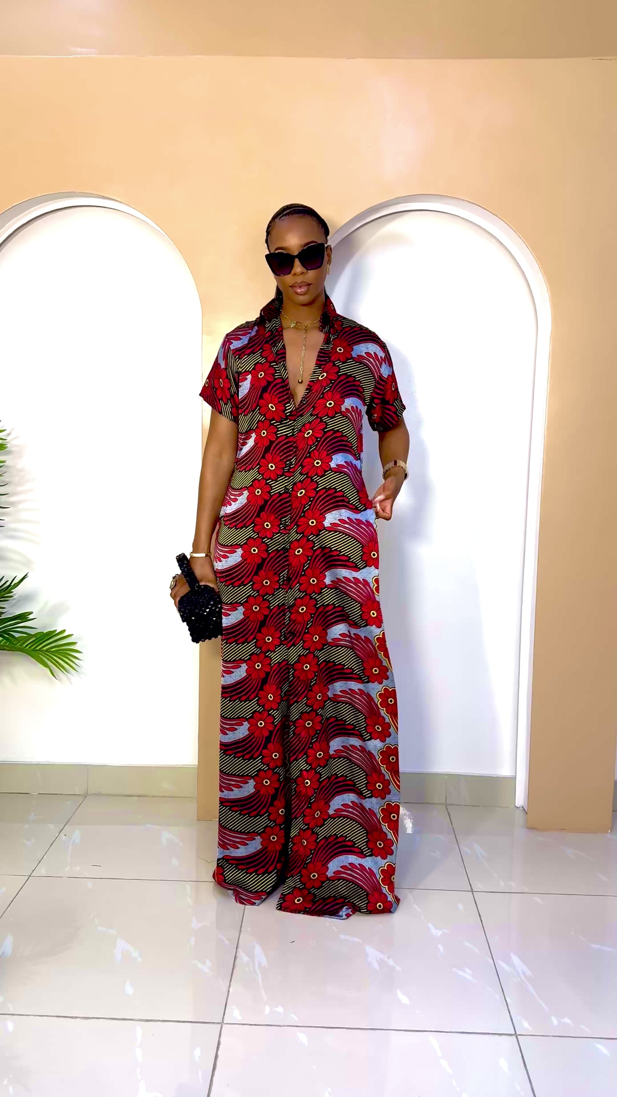 Sophisticated unlined kaftan dress made from traditional silk African Ankara fabric in vibrant multi-color patterns. Perfect for weddings, dinner parties, and formal events. Model height: 5'9".